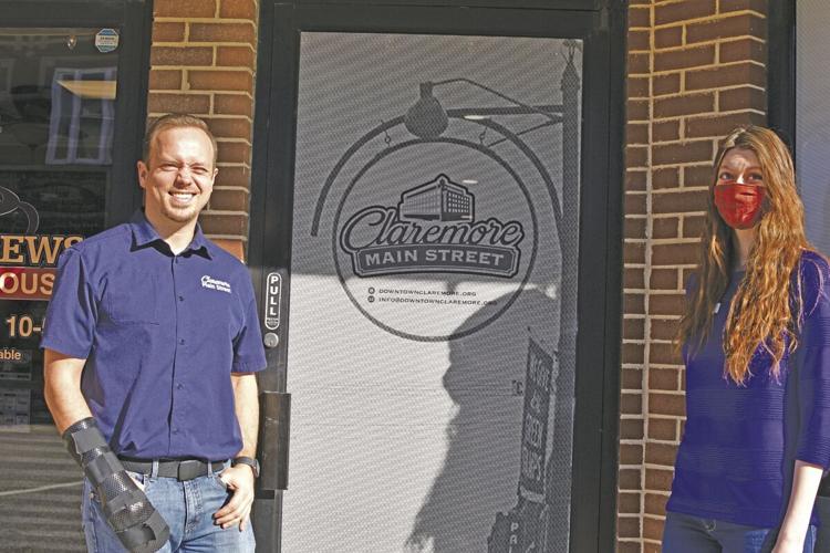 Executive Director Jacob Garrison and Executive Assistant Shiloh Johnson stand outside the new offices of Claremore Main Street. Chelsea Weeks / Progress photo